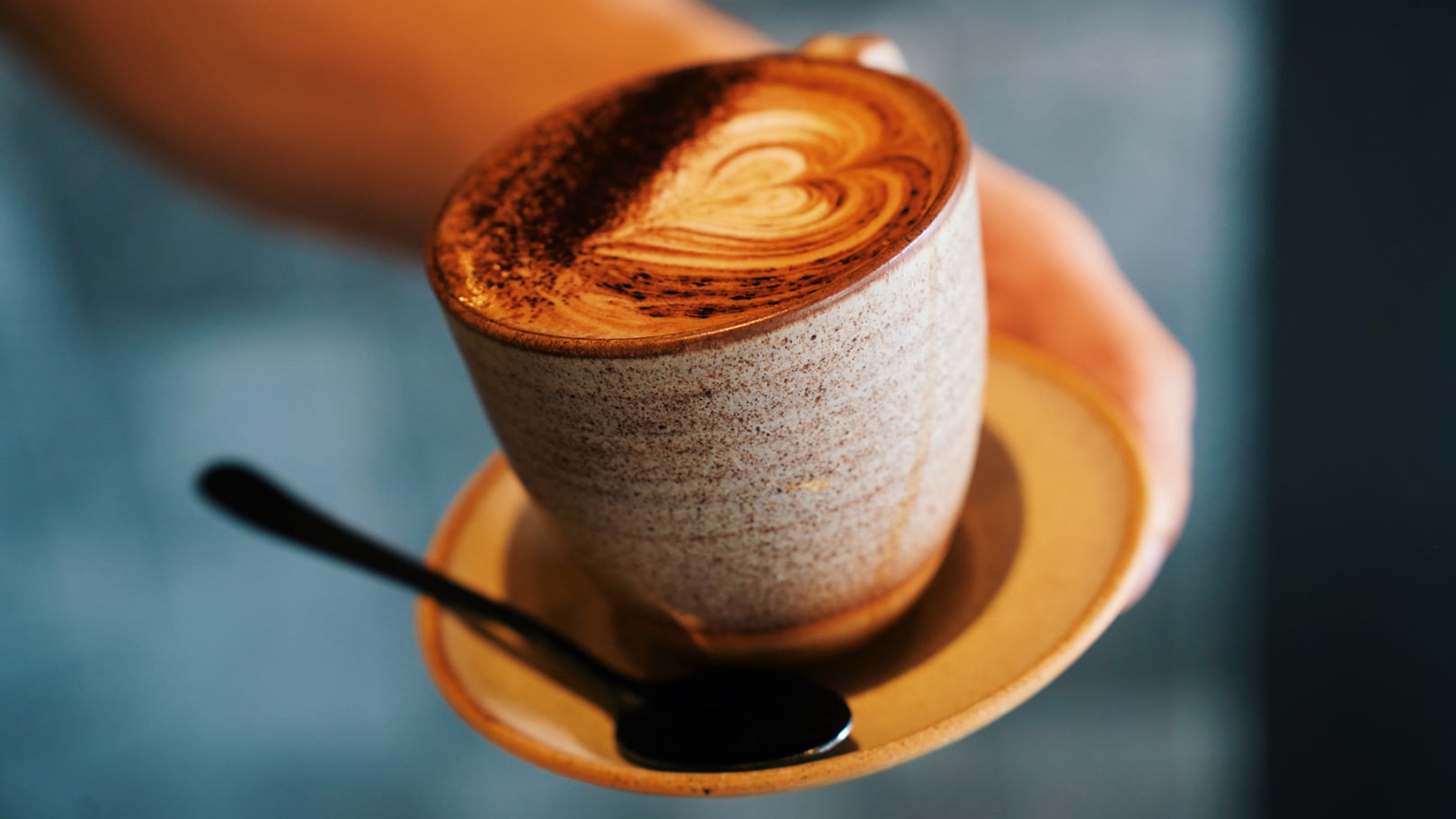 Artisan latte with heart-shaped coffee art served at Thirty Five Stirling café in Thebarton, Adelaide.