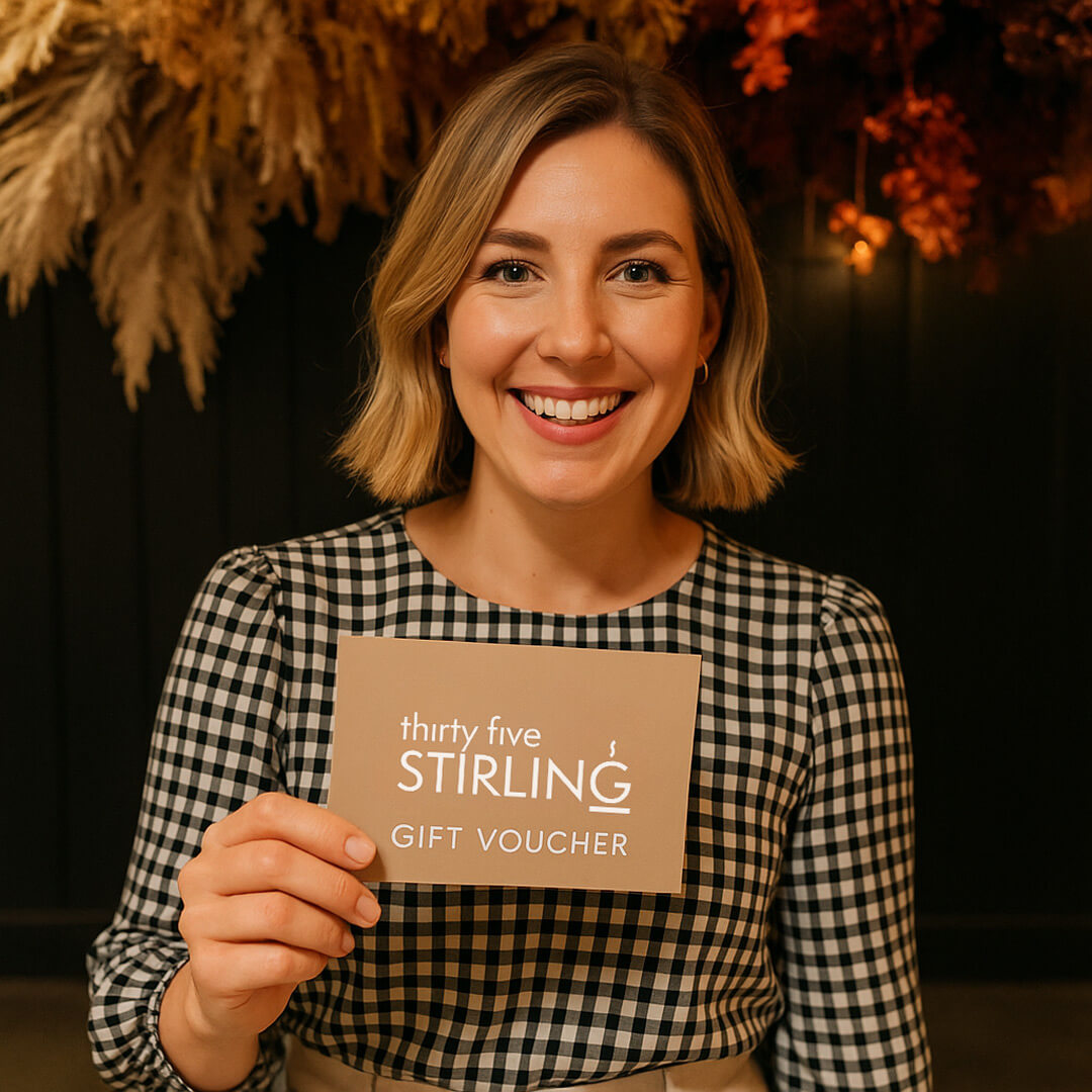 Happy customer holding a Thirty Five Stirling café gift voucher, perfect for brunch lovers in Adelaide.